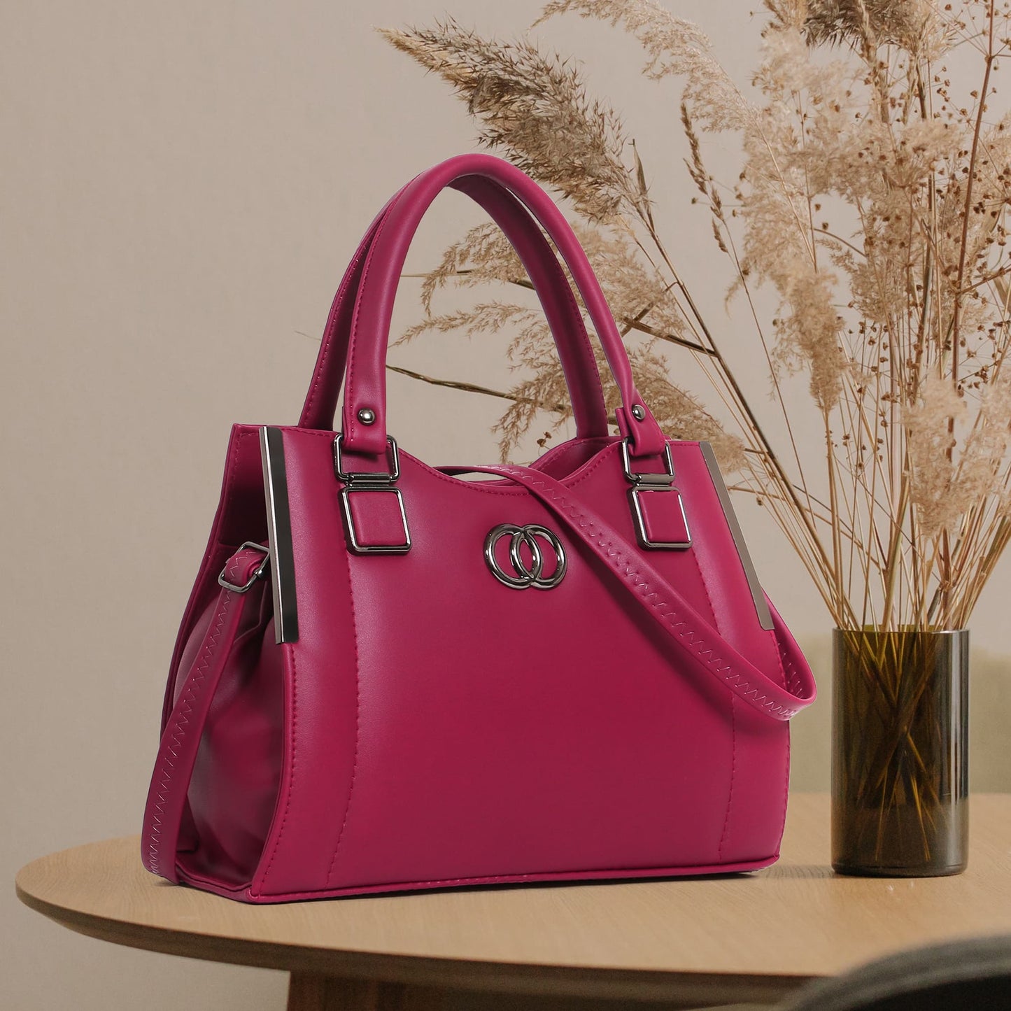  Front view of Chic Fuchsia Handbag showcasing sleek design and silver-tone hardware